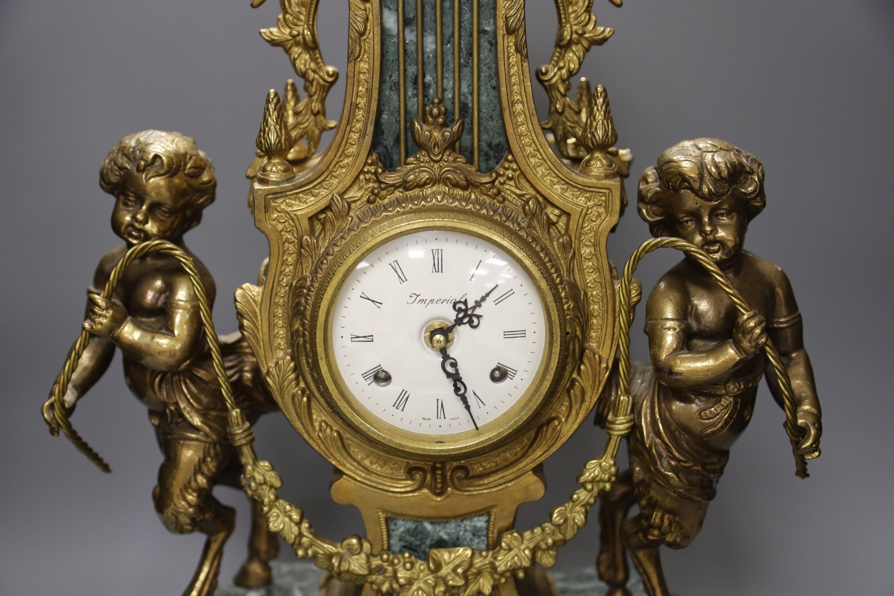 A Louis XVI style ormolu and variegated green marble mantel clock, H approx 60cm